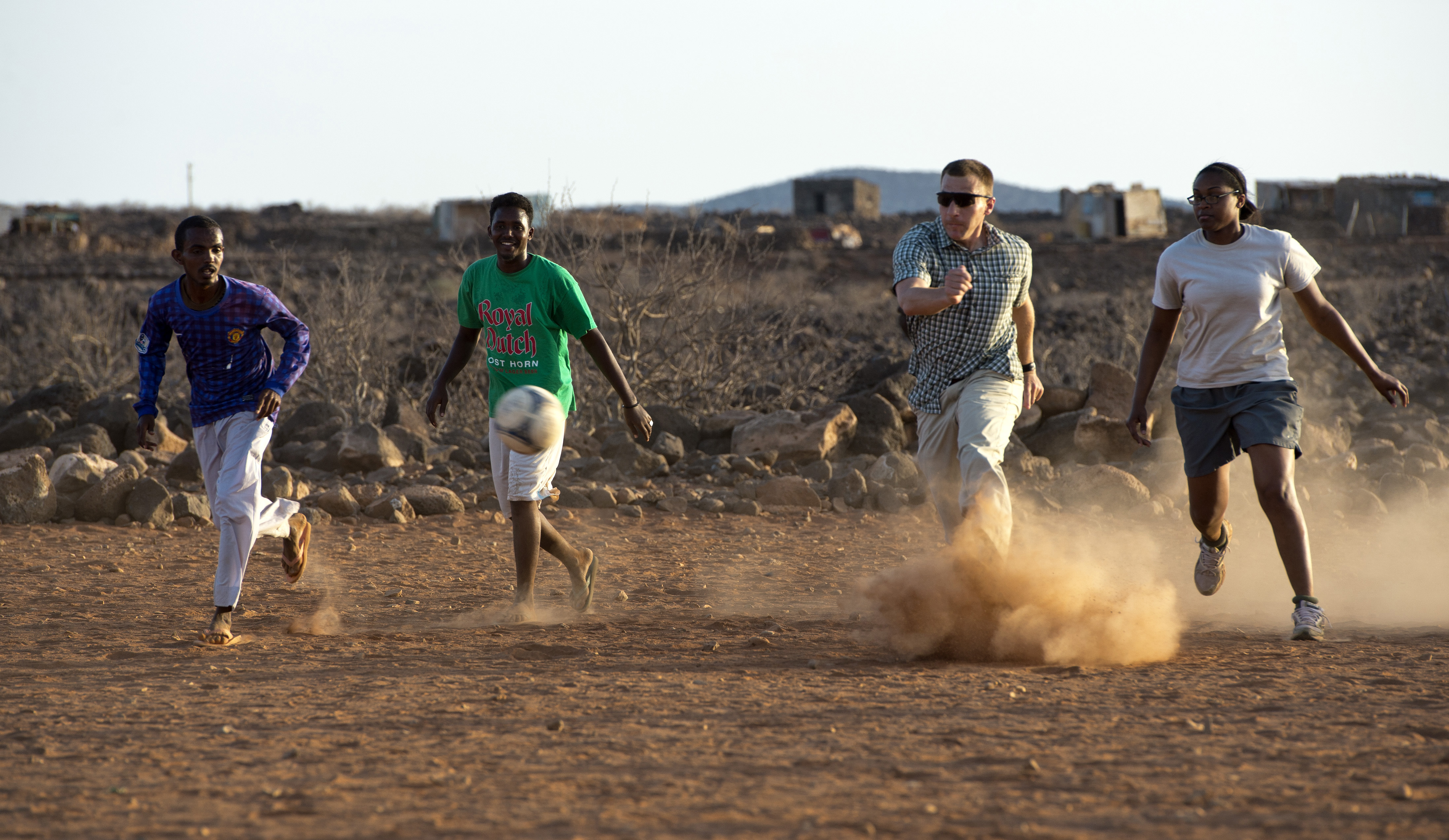 Player for CJTF-HOA Soccer Team kicks Ball during Chebelley Village