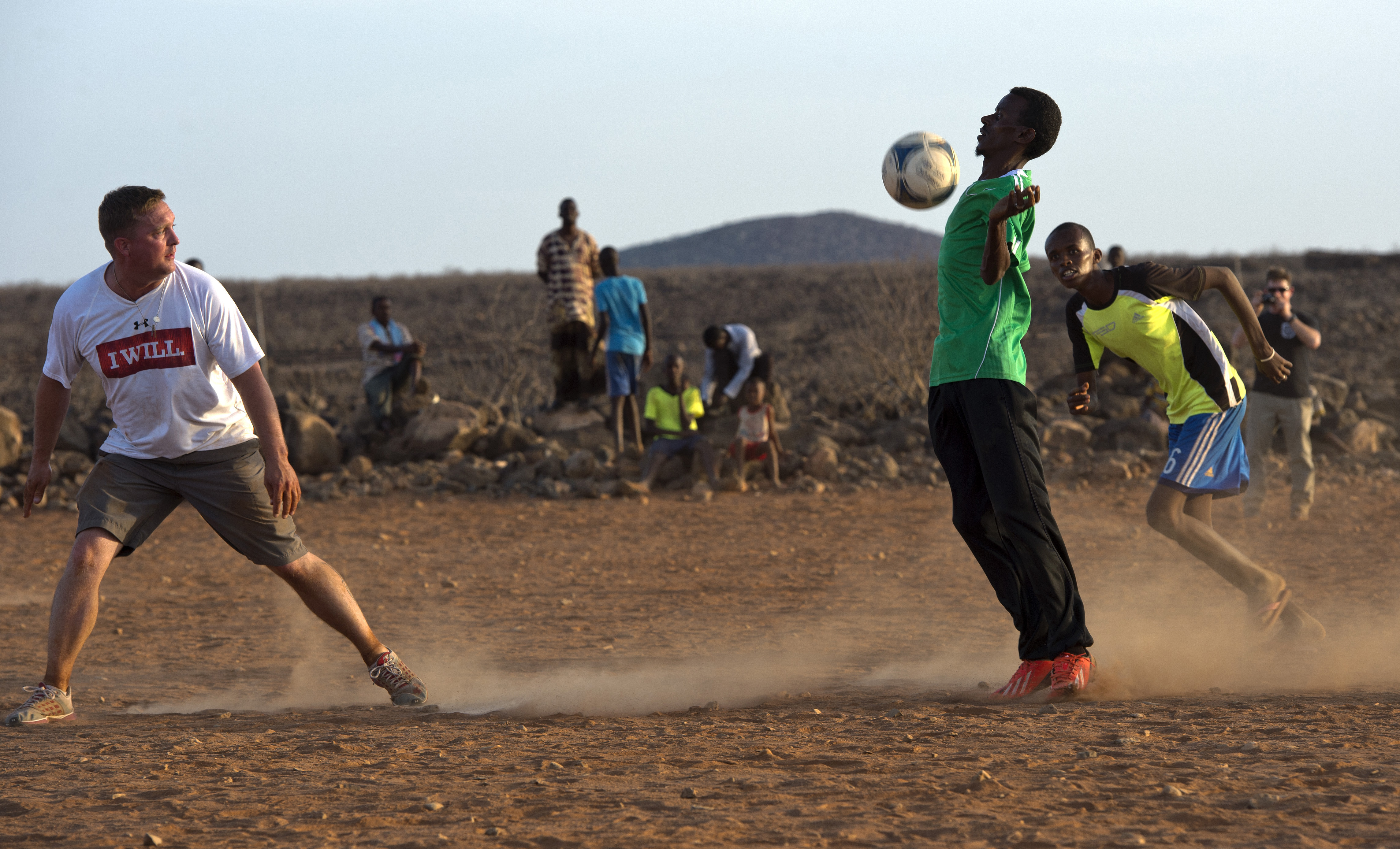 Forward for CJTFHOA Soccer Team Chest Blocks Soccer Ball during